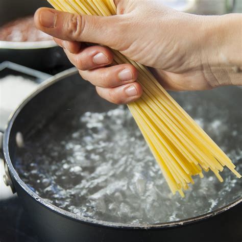 Adding pasta to boiling water